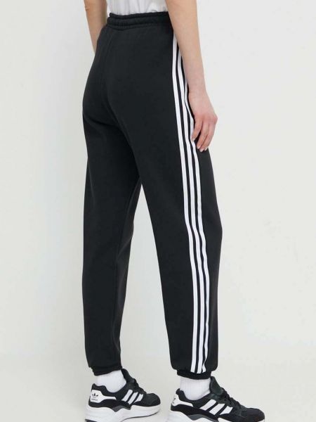 Bavlněné sportovní kalhoty s aplikacemi Adidas Originals černé