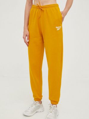 Reebok pantaloni de trening femei, culoarea portocaliu, neted