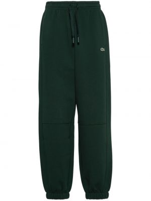 Teplákové nohavice Lacoste zelená