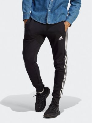Pruhované sportovní kalhoty Adidas černé