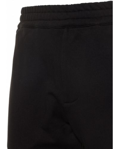 Bavlnené teplákové nohavice Alexander Mcqueen čierna