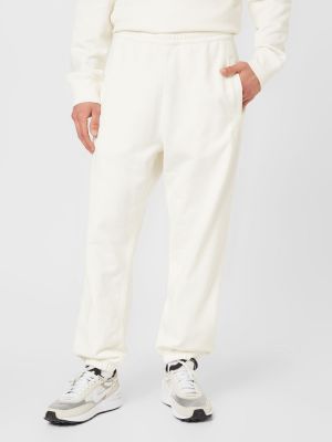 Teplákové nohavice Carhartt Wip biela