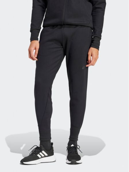 Priliehavé teplákové nohavice Adidas čierna