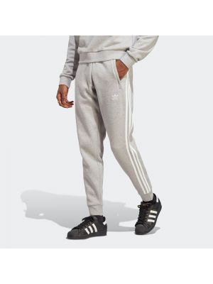 Pruhované priliehavé nohavice Adidas Originals