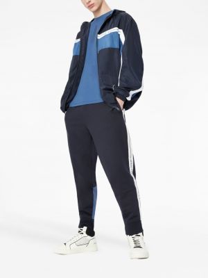 Spodnie sportowe z nadrukiem Armani Exchange niebieskie