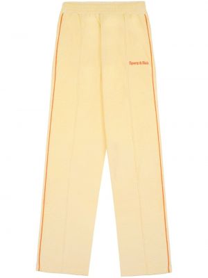 Teplákové nohavice s výšivkou Sporty & Rich žltá