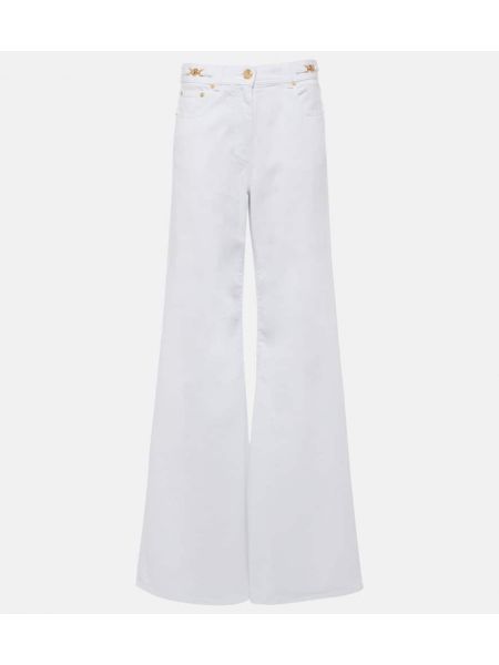 Jeans a zampa Versace bianco
