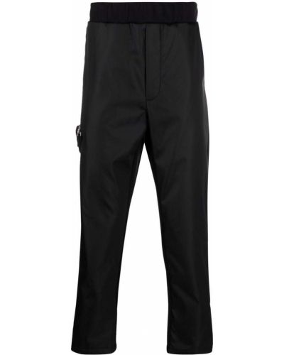 Pantalones de nailon con cremallera Prada negro