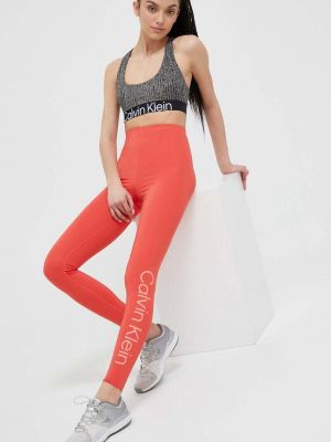 Pomarańczowe spodnie sportowe z nadrukiem Calvin Klein Performance