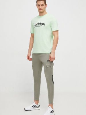 Spodnie sportowe z nadrukiem Adidas zielone