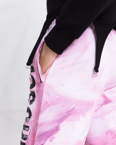 Sportovní kalhoty s potiskem s abstraktním vzorem Moschino růžové