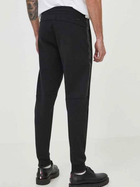 Sportovní kalhoty s aplikacemi Calvin Klein černé