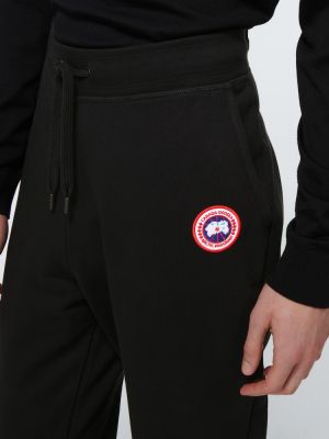Памучни спортни панталони Canada Goose черно