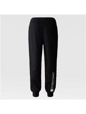 Spodnie sportowe bawełniane z kieszeniami z nadrukiem The North Face czarne